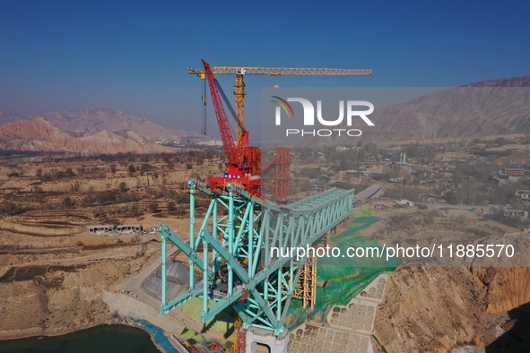 An aerial photo shows the construction of the Jianzha Yellow River Bridge, a key project of the Sichuan-Qinghai Railway in Jianzha County, Q...