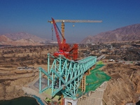 An aerial photo shows the construction of the Jianzha Yellow River Bridge, a key project of the Sichuan-Qinghai Railway in Jianzha County, Q...