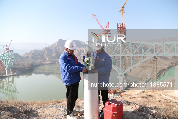 An aerial photo shows the construction of the Jianzha Yellow River Bridge, a key project of the Sichuan-Qinghai Railway in Jianzha County, Q...