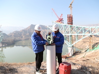 An aerial photo shows the construction of the Jianzha Yellow River Bridge, a key project of the Sichuan-Qinghai Railway in Jianzha County, Q...