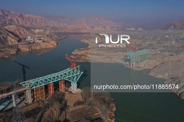 An aerial photo shows the construction of the Jianzha Yellow River Bridge, a key project of the Sichuan-Qinghai Railway in Jianzha County, Q...