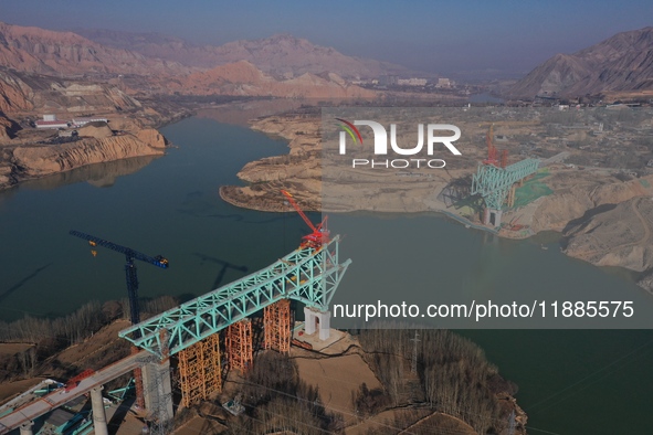 An aerial photo shows the construction of the Jianzha Yellow River Bridge, a key project of the Sichuan-Qinghai Railway in Jianzha County, Q...