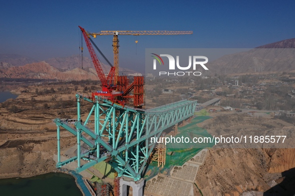 An aerial photo shows the construction of the Jianzha Yellow River Bridge, a key project of the Sichuan-Qinghai Railway in Jianzha County, Q...