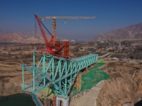 An aerial photo shows the construction of the Jianzha Yellow River Bridge, a key project of the Sichuan-Qinghai Railway in Jianzha County, Q...