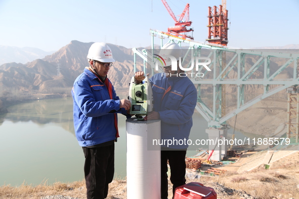 An aerial photo shows the construction of the Jianzha Yellow River Bridge, a key project of the Sichuan-Qinghai Railway in Jianzha County, Q...