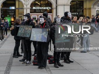 The group 'Anonymous for the Voiceless', an animal rights organization specializing in street activism, holds a 'Cubes of Truth' protest act...