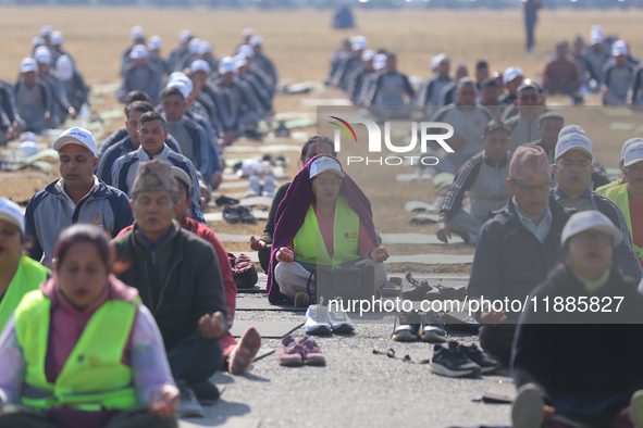 People meditate during a celebratory event organized on the occasion of the first World Meditation Day in Kathmandu, Nepal, on December 21,...