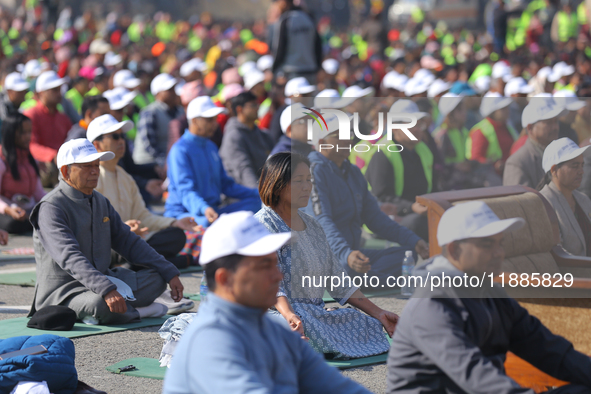 Deputy House Speaker Indira Rana Magar meditates during an event organized to mark World Meditation Day in Kathmandu, Nepal, on December 21,...