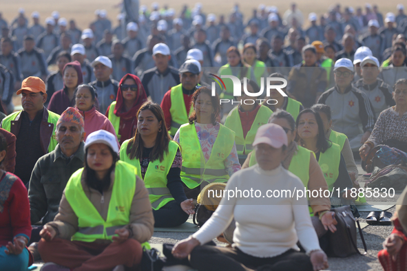 People meditate during a celebratory event organized on the occasion of the first World Meditation Day in Kathmandu, Nepal, on December 21,...