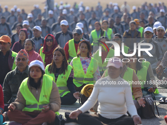 People meditate during a celebratory event organized on the occasion of the first World Meditation Day in Kathmandu, Nepal, on December 21,...