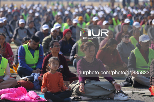 People meditate during a celebratory event organized on the occasion of the first World Meditation Day in Kathmandu, Nepal, on December 21,...