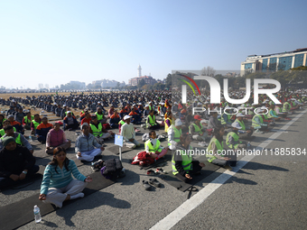 People meditate during a celebratory event organized on the occasion of the first World Meditation Day in Kathmandu, Nepal, on December 21,...