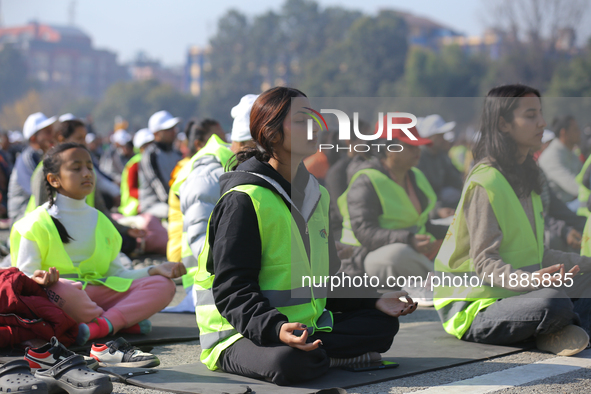 People meditate during a celebratory event organized on the occasion of the first World Meditation Day in Kathmandu, Nepal, on December 21,...