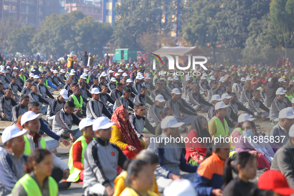 People meditate during a celebratory event organized on the occasion of the first World Meditation Day in Kathmandu, Nepal, on December 21,...