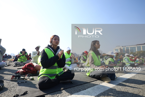 People meditate during a celebratory event organized on the occasion of the first World Meditation Day in Kathmandu, Nepal, on December 21,...