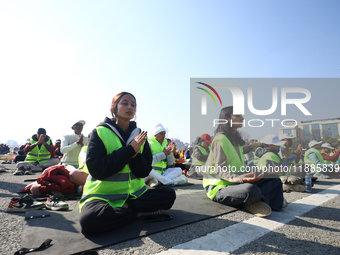 People meditate during a celebratory event organized on the occasion of the first World Meditation Day in Kathmandu, Nepal, on December 21,...