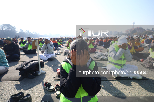 People meditate during a celebratory event organized on the occasion of the first World Meditation Day in Kathmandu, Nepal, on December 21,...