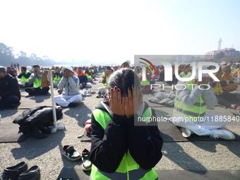 People meditate during a celebratory event organized on the occasion of the first World Meditation Day in Kathmandu, Nepal, on December 21,...