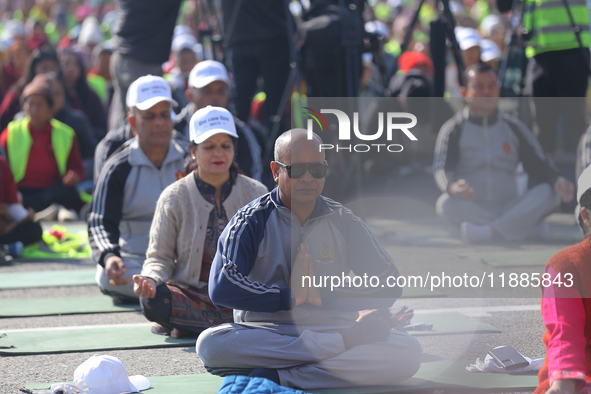 People meditate during a celebratory event organized on the occasion of the first World Meditation Day in Kathmandu, Nepal, on December 21,...