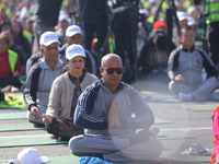 People meditate during a celebratory event organized on the occasion of the first World Meditation Day in Kathmandu, Nepal, on December 21,...