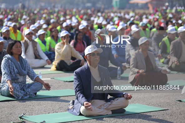 Nepali Prime Minister KP Sharma Oli (center) meditates during an event organized on the first World Meditation Day in Kathmandu, Nepal, on D...