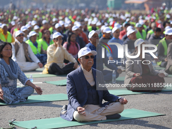 Nepali Prime Minister KP Sharma Oli (center) meditates during an event organized on the first World Meditation Day in Kathmandu, Nepal, on D...