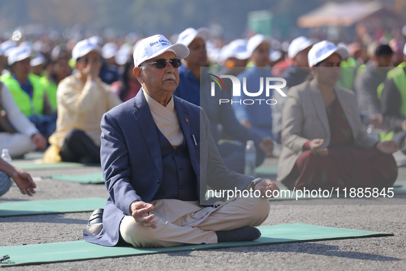 Nepali Prime Minister KP Sharma Oli (center) meditates during an event organized on the first World Meditation Day in Kathmandu, Nepal, on D...