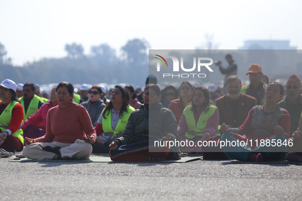 People meditate during a celebratory event organized on the occasion of the first World Meditation Day in Kathmandu, Nepal, on December 21,...