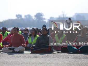 People meditate during a celebratory event organized on the occasion of the first World Meditation Day in Kathmandu, Nepal, on December 21,...