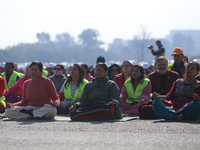 People meditate during a celebratory event organized on the occasion of the first World Meditation Day in Kathmandu, Nepal, on December 21,...