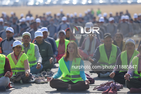 People meditate during a celebratory event organized on the occasion of the first World Meditation Day in Kathmandu, Nepal, on December 21,...