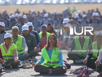 People meditate during a celebratory event organized on the occasion of the first World Meditation Day in Kathmandu, Nepal, on December 21,...