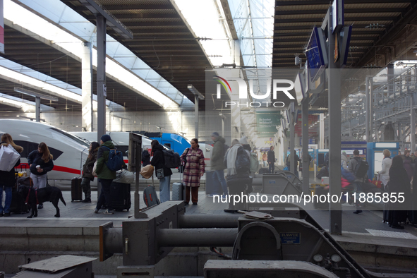 Trains and travelers are at Munich Central Station in Bavaria, Germany, on December 21, 2024. 