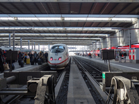 A regional train and an ICE train are at Munich Central Station in Bavaria, Germany, on December 21, 2024. Passengers get off the ICE train...