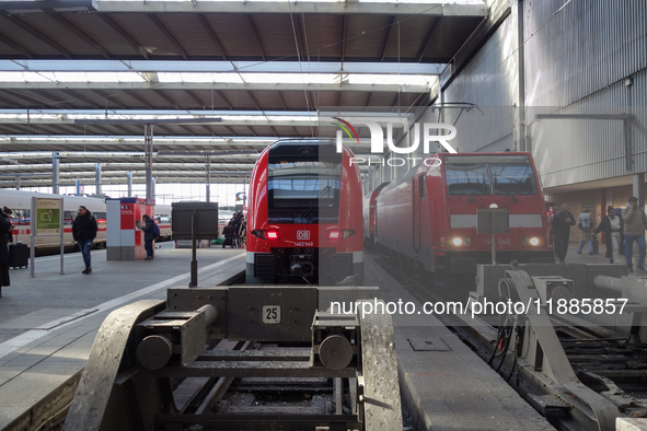 Two regional trains and an ICE are at Munich Central Station in Bavaria, Germany, on December 21, 2024. 