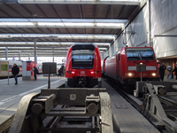 Two regional trains and an ICE are at Munich Central Station in Bavaria, Germany, on December 21, 2024. (