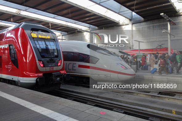 Two regional trains and two ICE trains are at Munich Central Station in Bavaria, Germany, on December 21, 2024. 