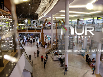 Shoppers make last minute shopping in Bonarka shopping mall ahead of Christmas Day on Saturday December 21, 2024. (