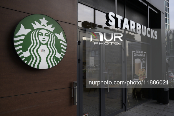 The Starbucks logo and signage are pictured in Warsaw, Poland, on December 21, 2024. 