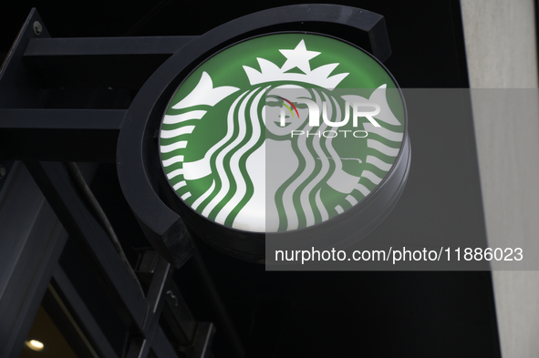 The Starbucks logo and signage are pictured in Warsaw, Poland, on December 21, 2024. 