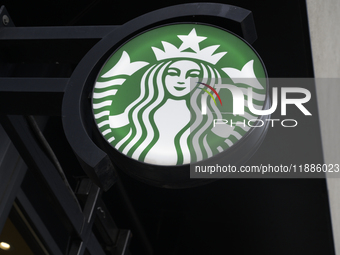 The Starbucks logo and signage are pictured in Warsaw, Poland, on December 21, 2024. (