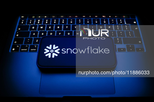 A laptop keyboard and Snowflake logo displayed on a smartphone are seen in this illustration photo taken in Krakow, Poland on December 21, 2...