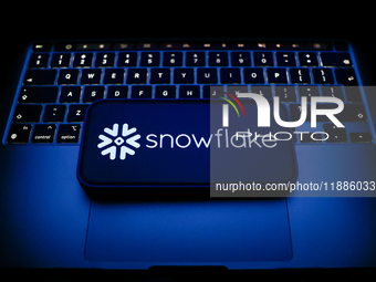 A laptop keyboard and Snowflake logo displayed on a smartphone are seen in this illustration photo taken in Krakow, Poland on December 21, 2...