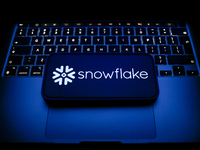 A laptop keyboard and Snowflake logo displayed on a smartphone are seen in this illustration photo taken in Krakow, Poland on December 21, 2...