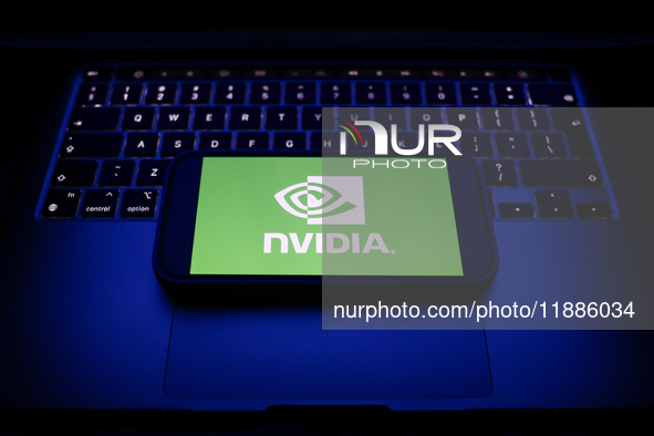 A laptop keyboard and Nvidia logo displayed on a smartphone are seen in this illustration photo taken in Krakow, Poland on December 21, 2024...