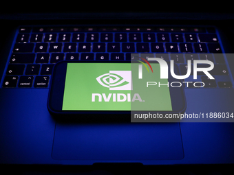 A laptop keyboard and Nvidia logo displayed on a smartphone are seen in this illustration photo taken in Krakow, Poland on December 21, 2024...