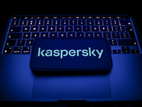 A laptop keyboard and Kaspersky logo displayed on a smartphone are seen in this illustration photo taken in Krakow, Poland on December 21, 2...