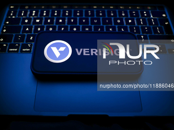 A laptop keyboard and Verisign logo displayed on a smartphone are seen in this illustration photo taken in Krakow, Poland on December 21, 20...