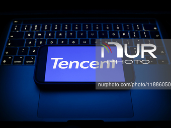 A laptop keyboard and Tencent logo displayed on a smartphone are seen in this illustration photo taken in Krakow, Poland on December 21, 202...