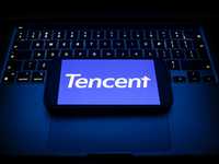 A laptop keyboard and Tencent logo displayed on a smartphone are seen in this illustration photo taken in Krakow, Poland on December 21, 202...